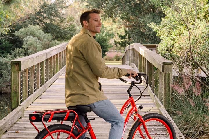a man riding on the back of a bicycle