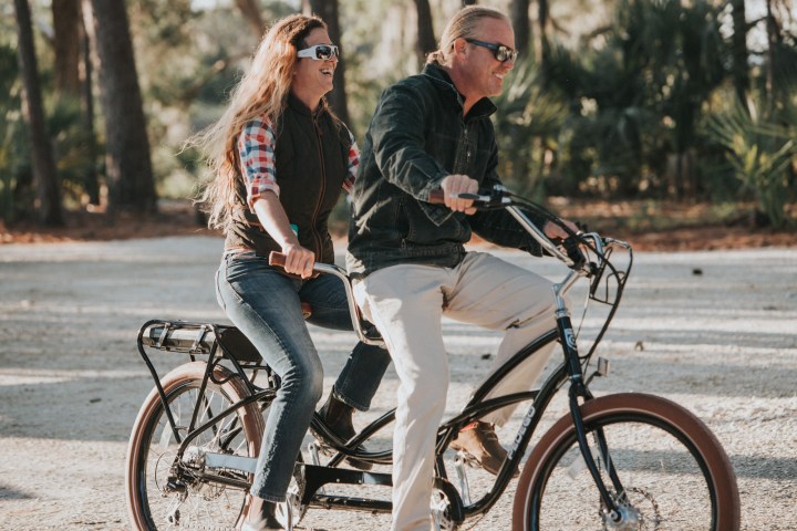 a person riding on the back of a bicycle