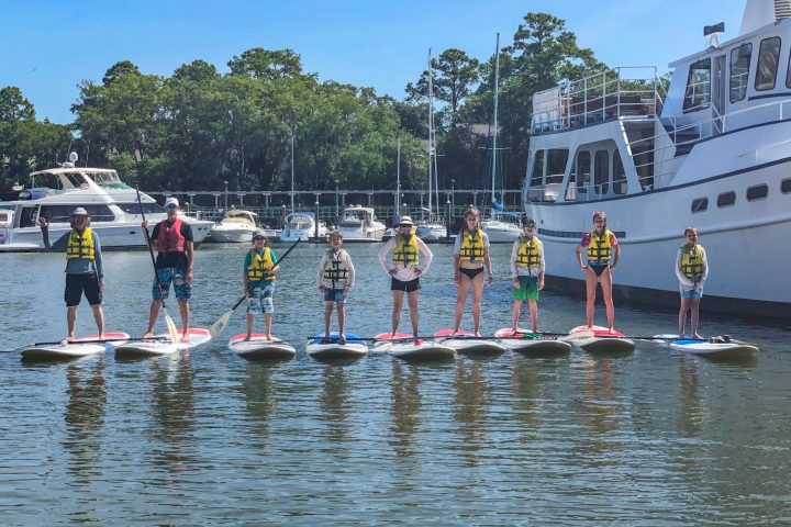a group of people on a boat in the water
