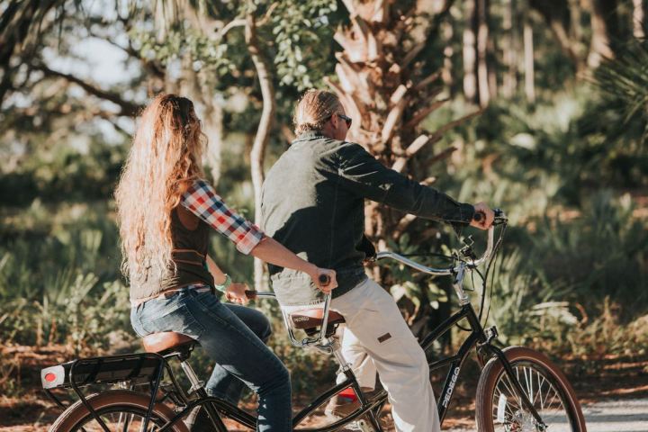 2 people on a tandem bike