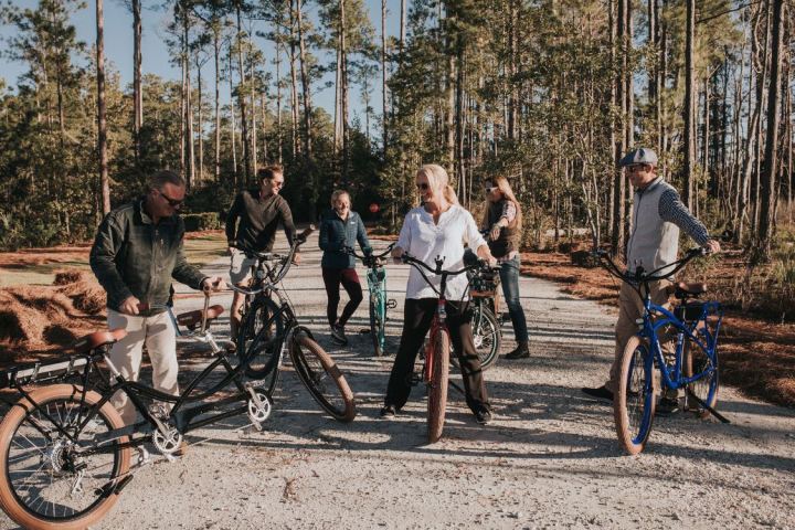 Group of people hanging out with their bikes