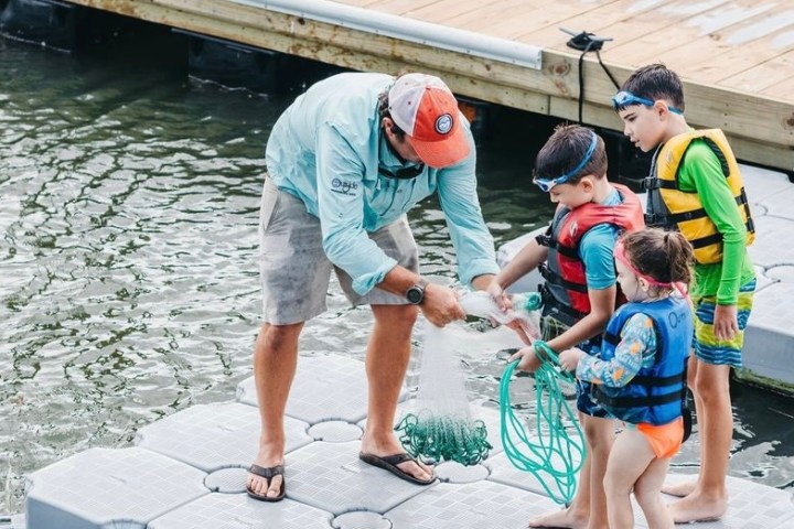 a couple of people that are standing in the water