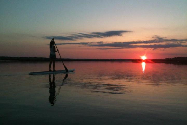 a sunset over a body of water