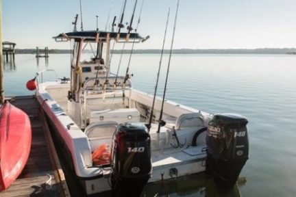 a boat is docked next to a body of water