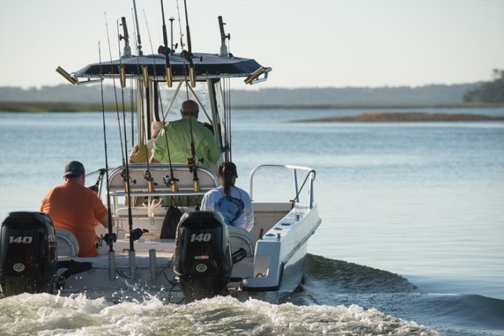 a group of people in a boat on a body of water