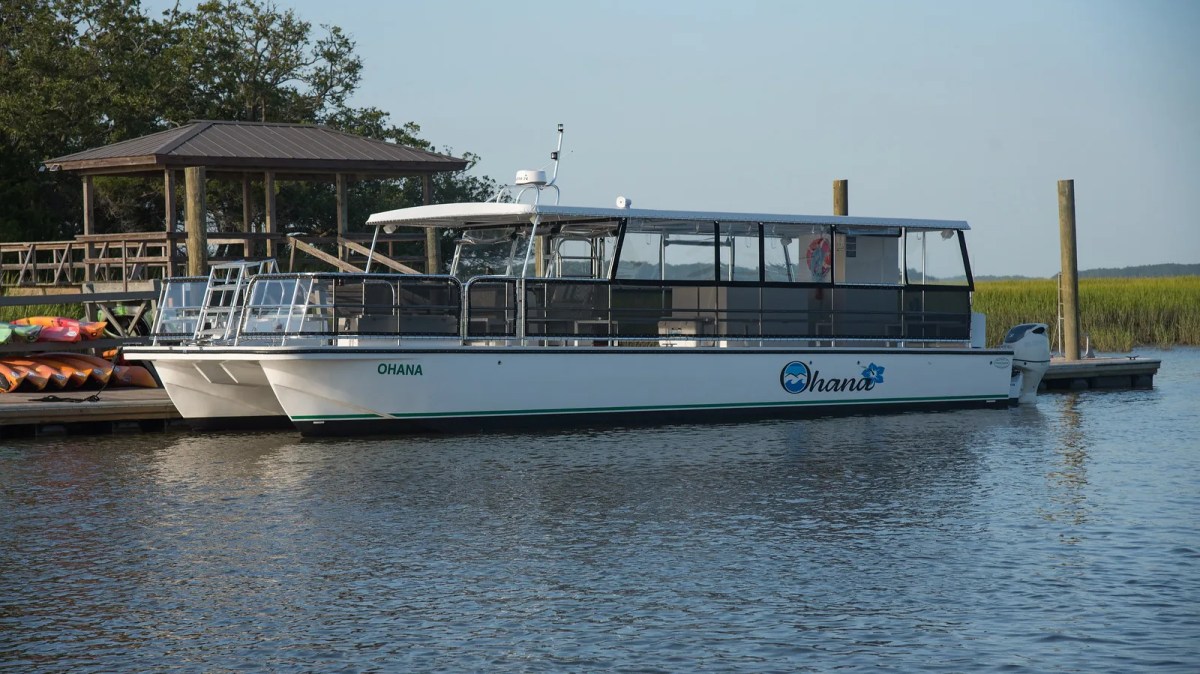 a boat is docked next to a body of water