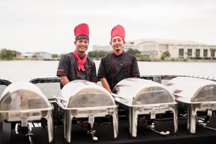 a man and a woman sitting on a boat