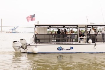 a group of people on a boat in the water